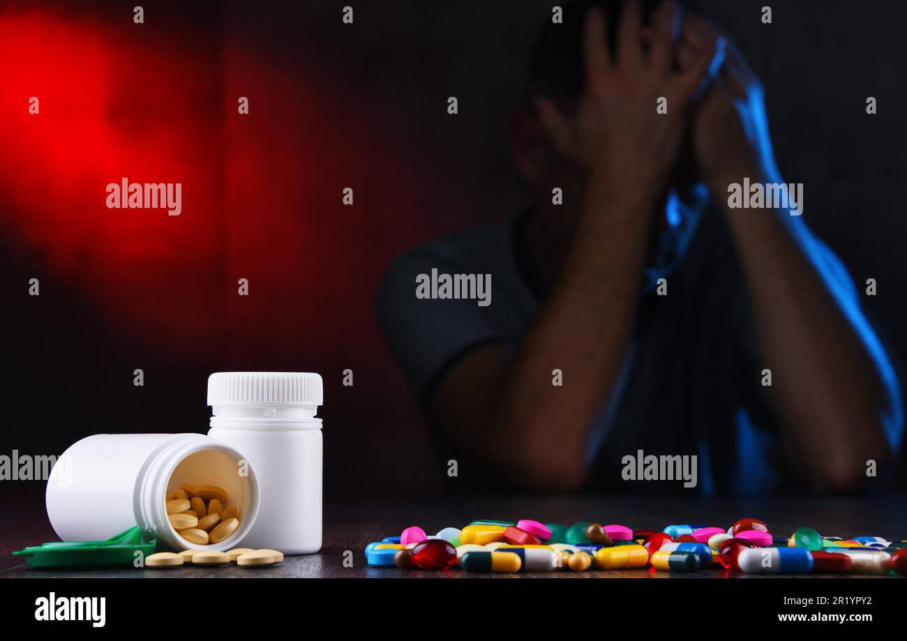 Drugs and the figure of a addicted man Stock Photo