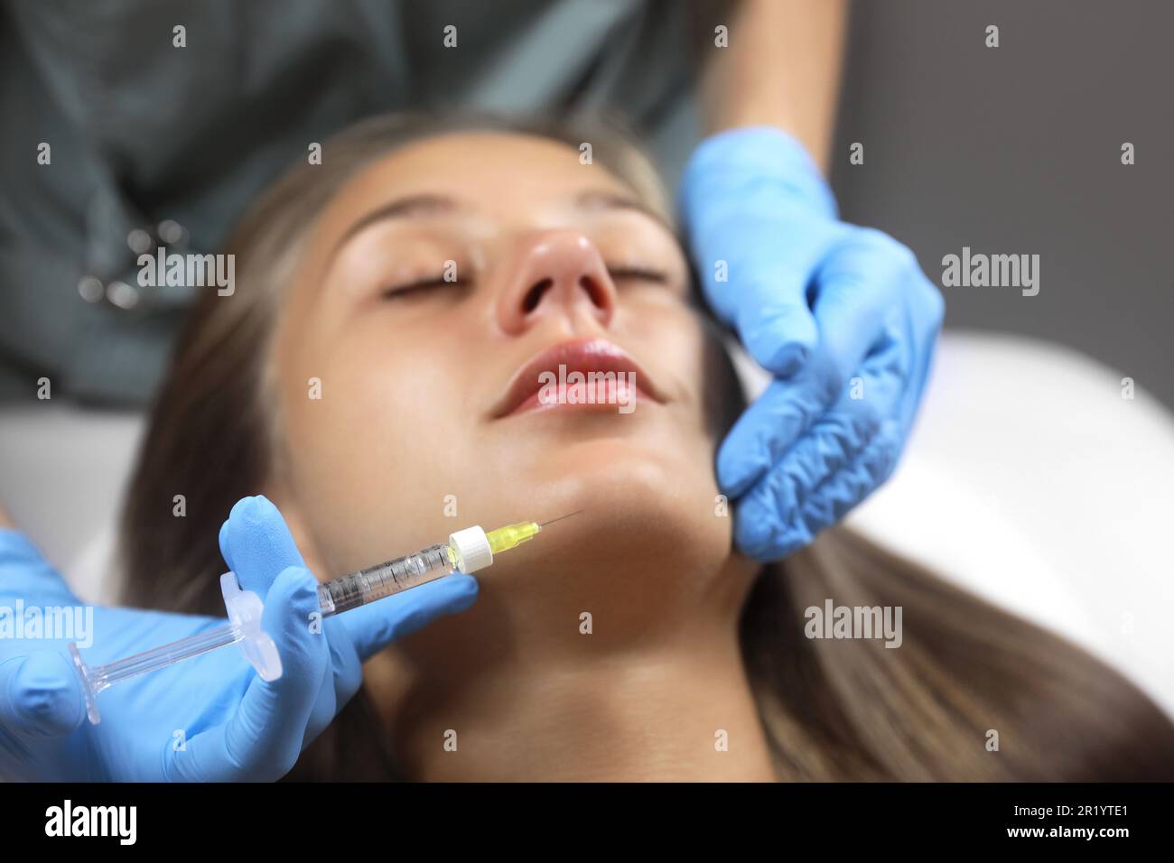Woman getting an injection hi-res stock photography and images - Alamy