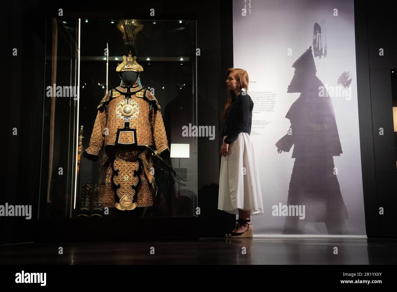 A British Museum worker looks at Bannerman during a photo call for the