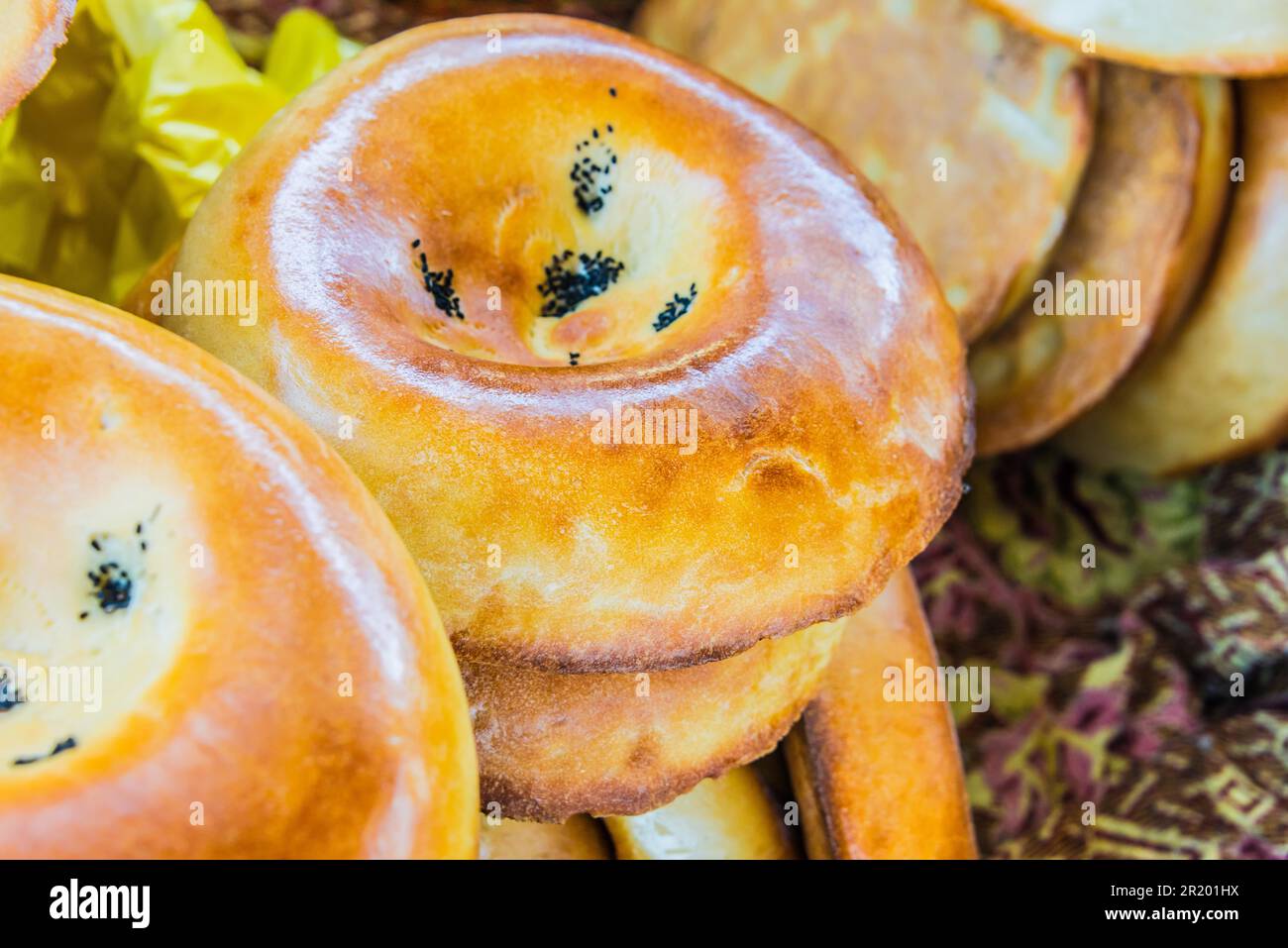 Tandir non or lepeshka, tarditional uzbek bread sold at Siab Bazaar in Samarkand, Uzbekistan Stock Photo