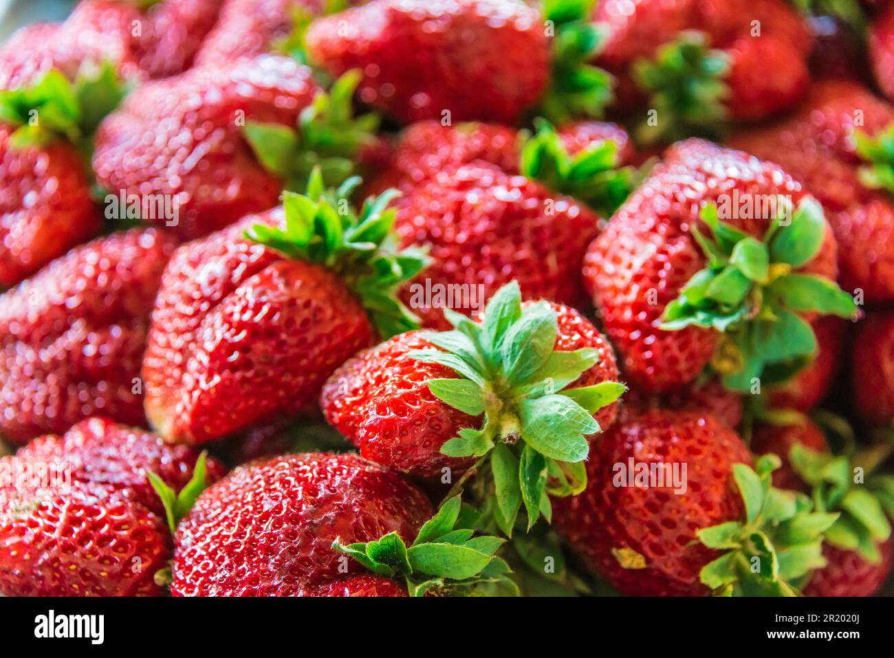 Strawberries sold on the street market stall Stock Photo Alamy