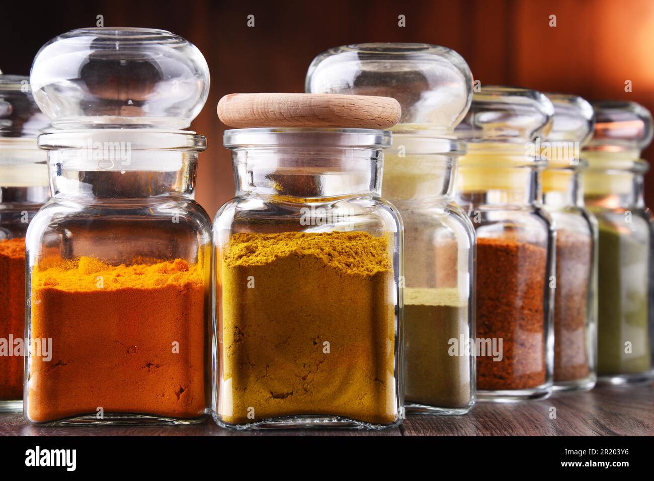 Glass storage jars with spices and herbs Stock Photo - Alamy