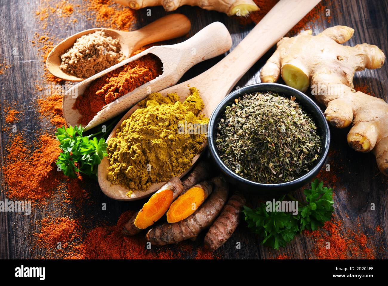 Composition with spices on wooden kitchen table Stock Photo