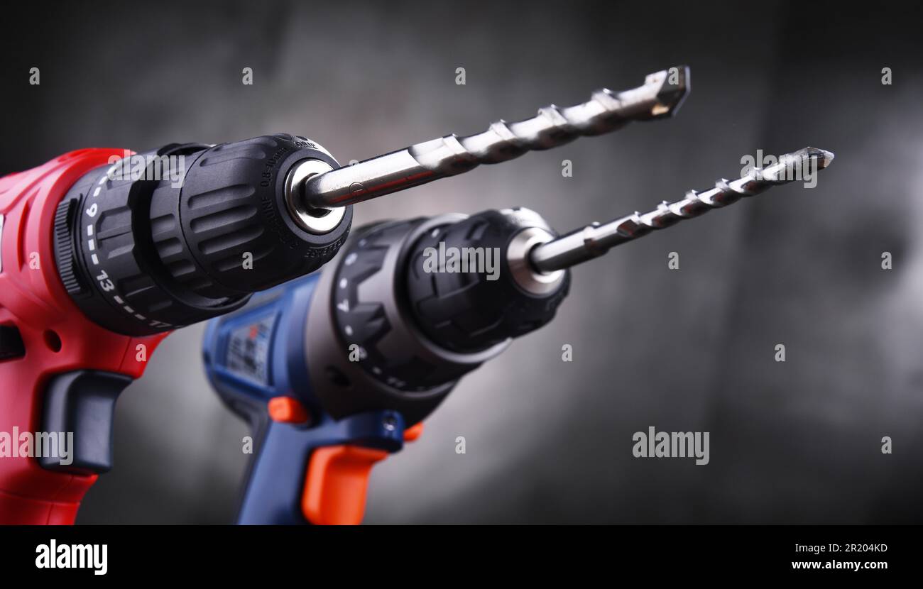 Composition with two cordless drills also working as screw guns Stock Photo
