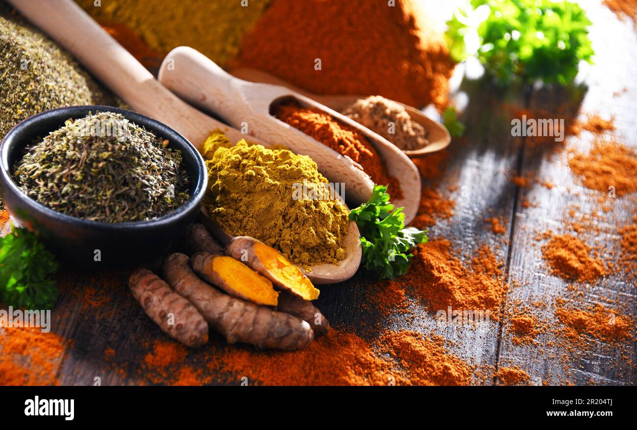 Composition with spices on wooden kitchen table Stock Photo