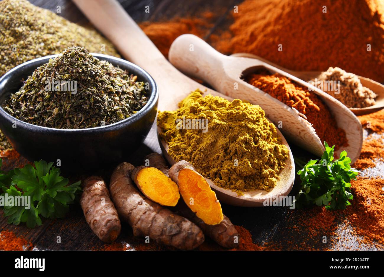 Composition with spices on wooden kitchen table Stock Photo