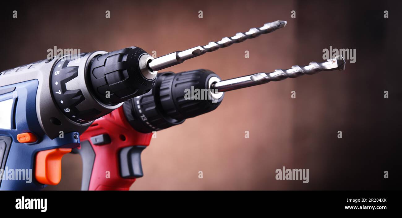 https://c8.alamy.com/comp/2R204XK/composition-with-two-cordless-drills-also-working-as-screw-guns-2R204XK.jpg