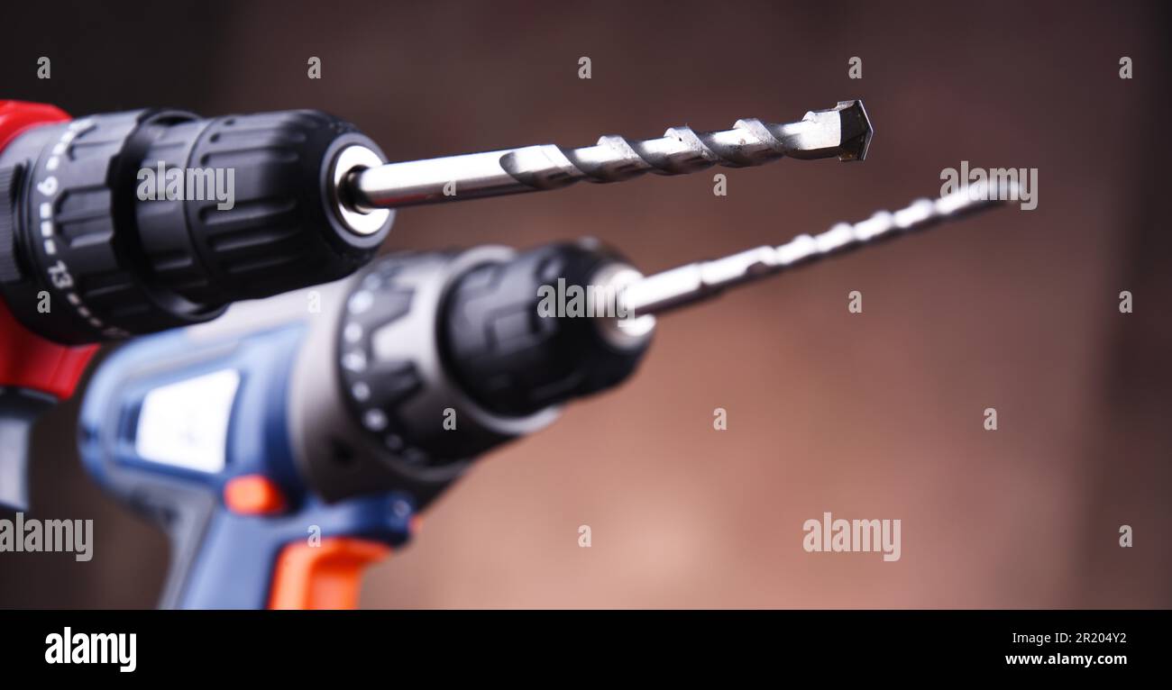 Composition with two cordless drills also working as screw guns Stock Photo