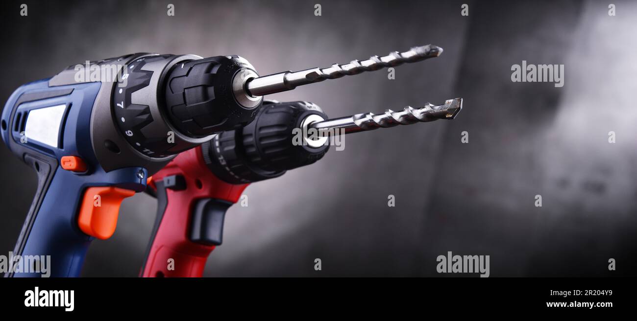 Composition with two cordless drills also working as screw guns Stock Photo