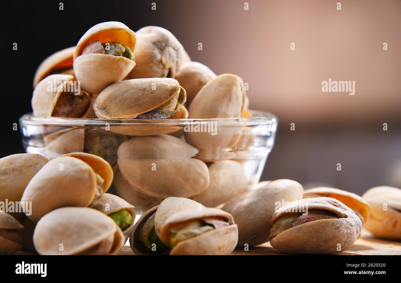 Shell Delicacy Composition with bowl of in shell pistachios. Delicacies Stock Photo ...