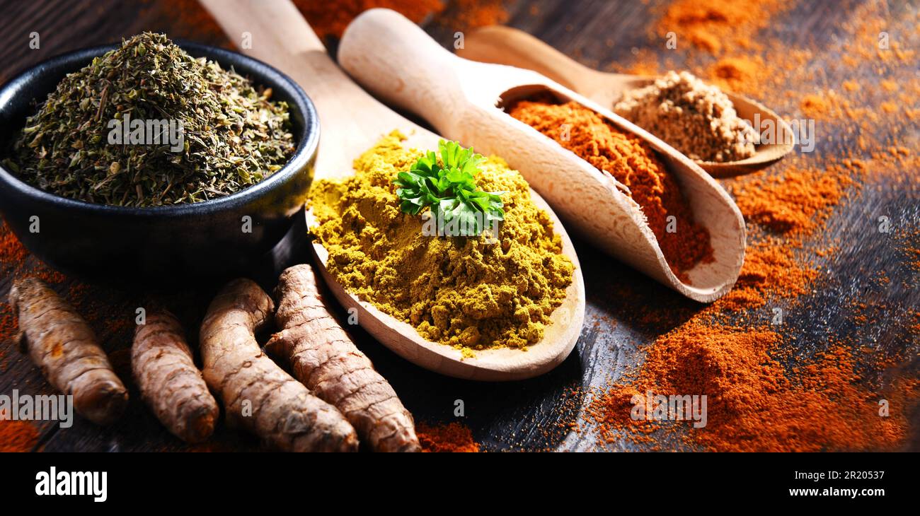 Composition with spices on wooden kitchen table Stock Photo
