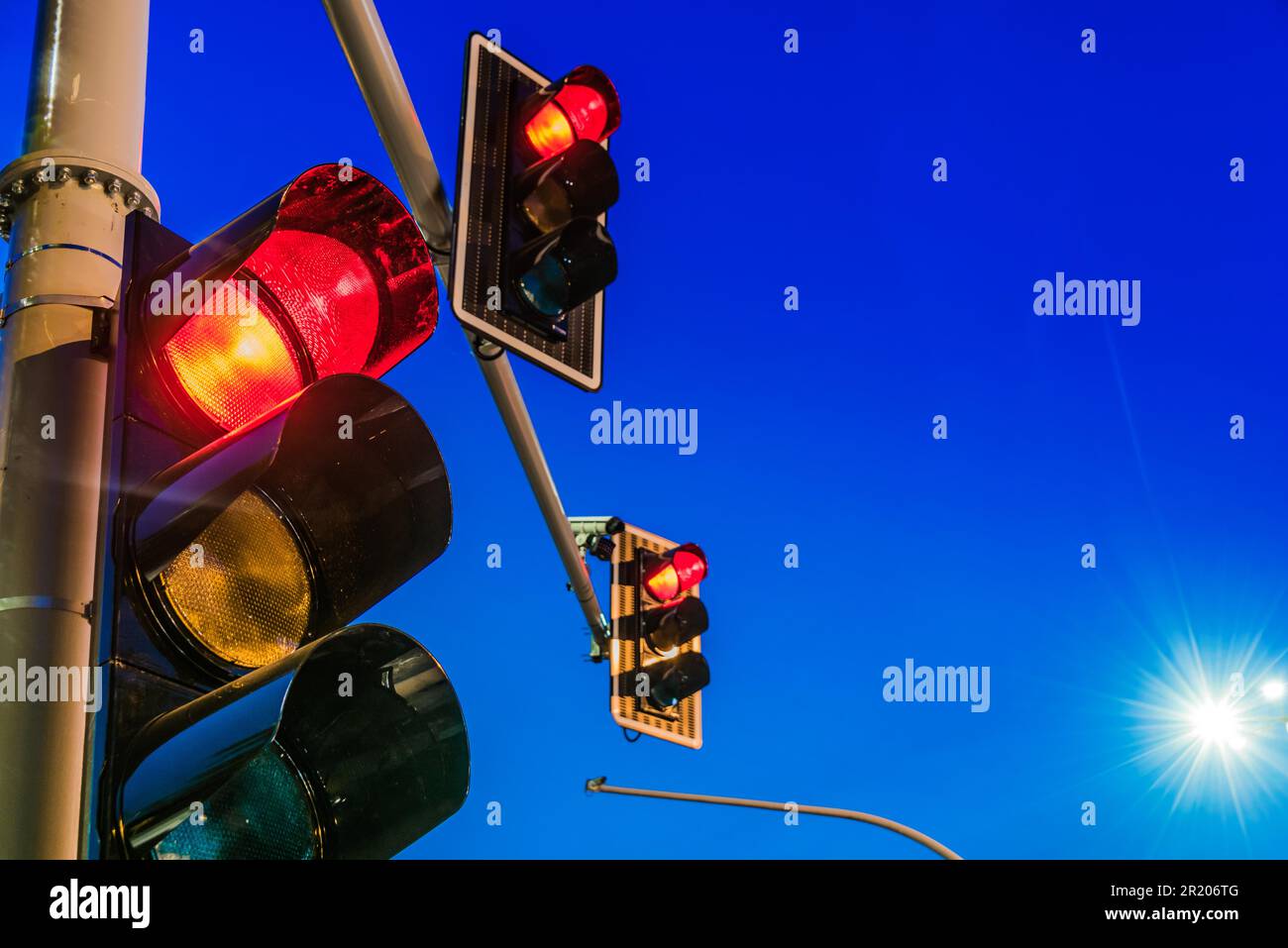 Traffic lights over urban intersection Stock Photo - Alamy