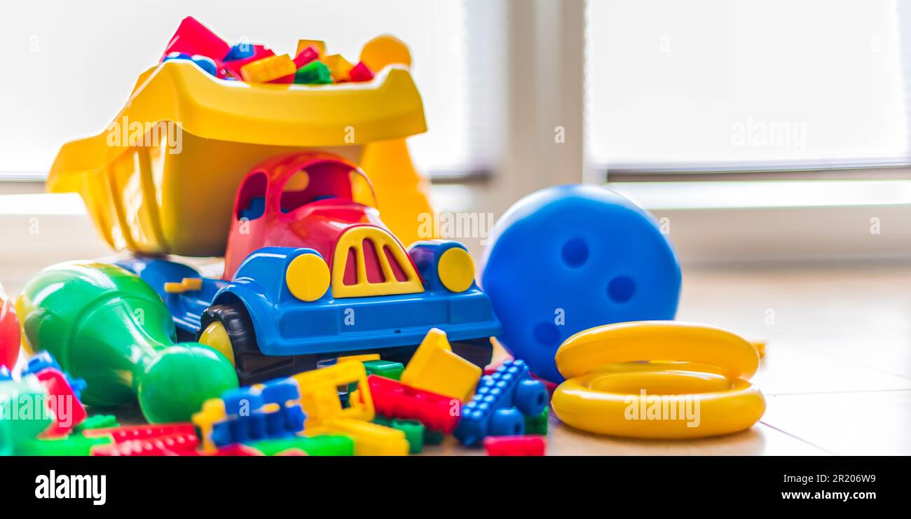 Colorful plastic children toys on the floor Stock Photo Alamy