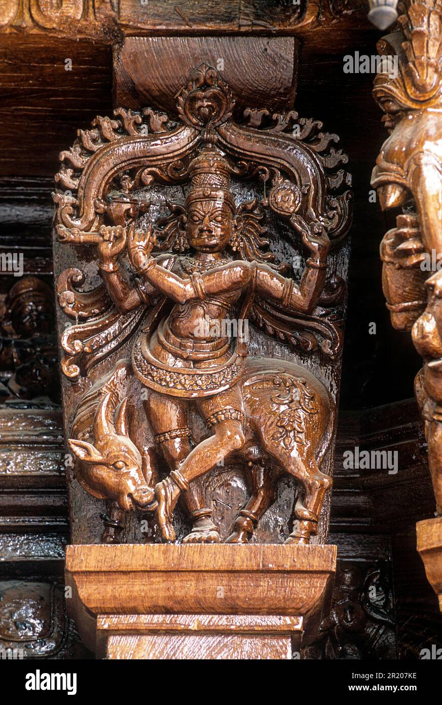 Venugopala Krishna with His Cow, 17th century wooden carvings in Meenakshi-Sundareswarar temple Chariot at Madurai, Tamil Nadu, South India, India Stock Photo
