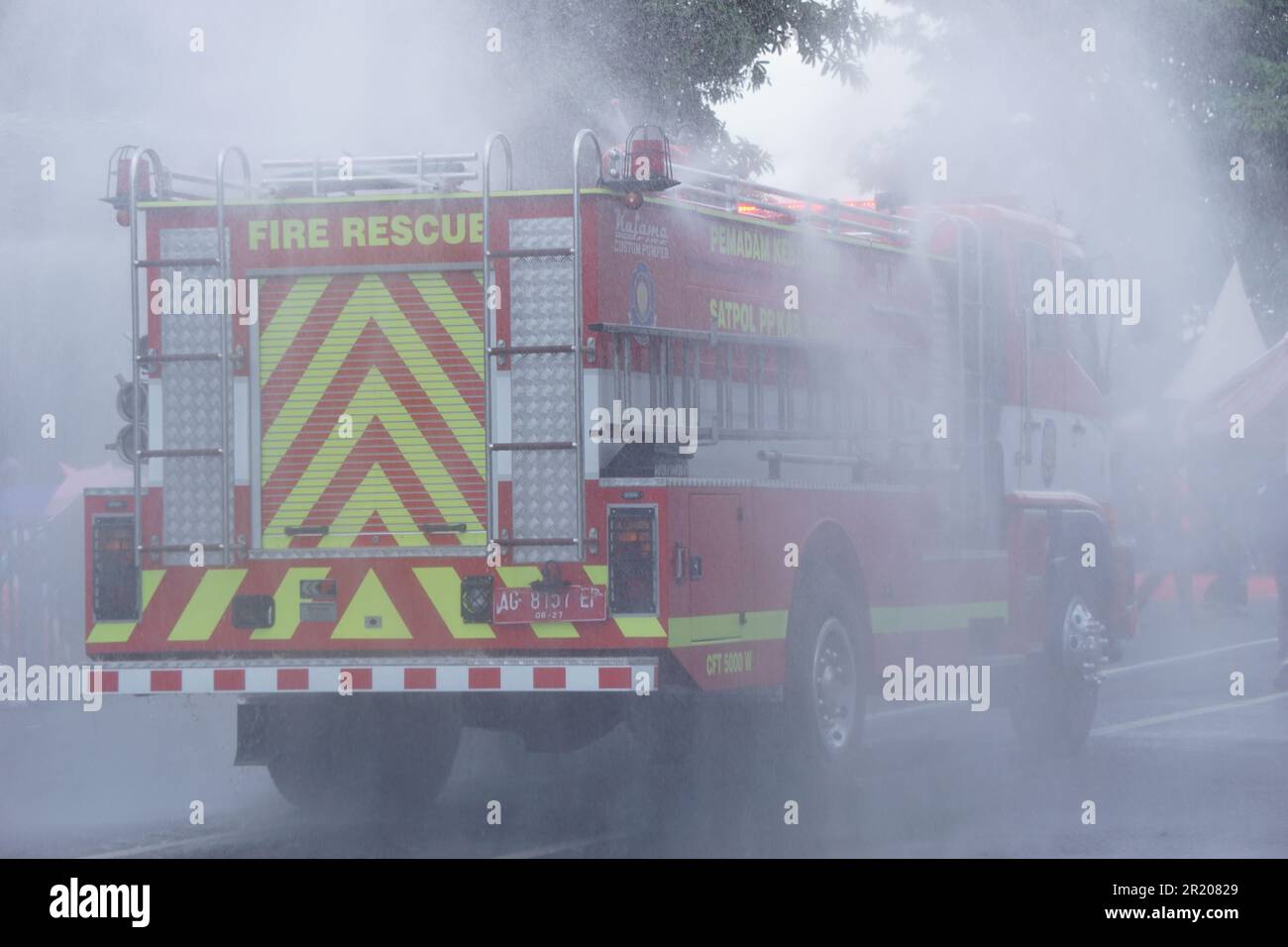 Red fire truck on the road Stock Photo - Alamy