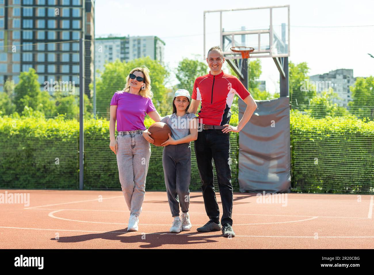 Caucasian family playing basketball together Stock Photo - Alamy