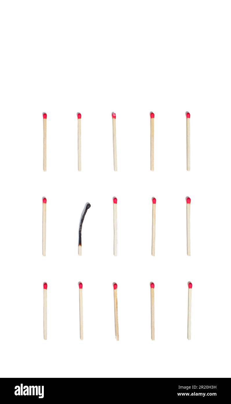 matches in order, one of them burnt Stock Photo