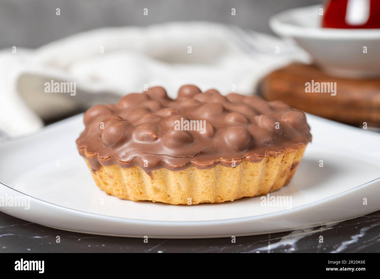 Chocolate pie. Hazelnut, cream and chocolate pie on dark background. Close up Stock Photo