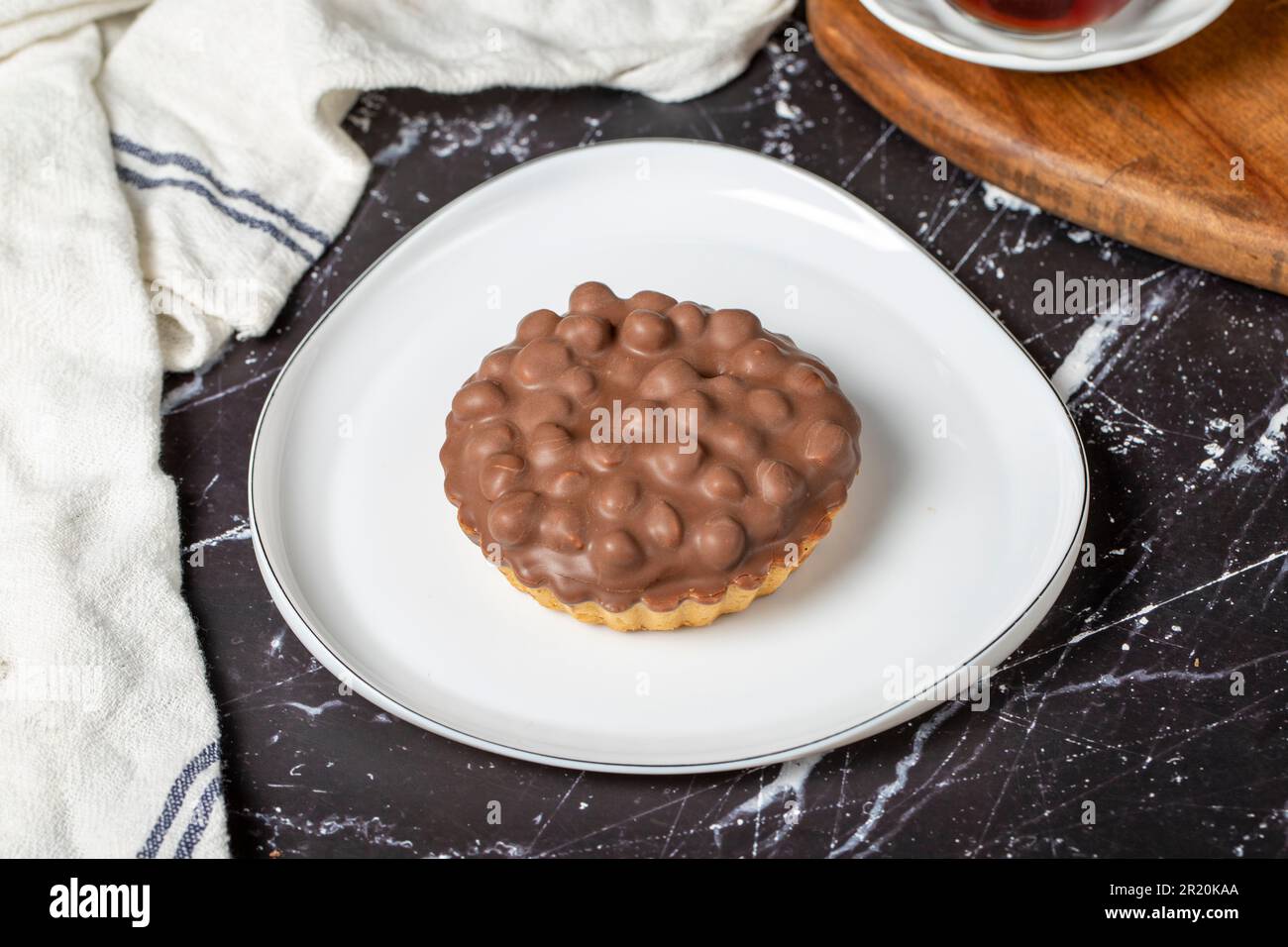 Chocolate pie. Hazelnut, cream and chocolate pie on dark background Stock Photo