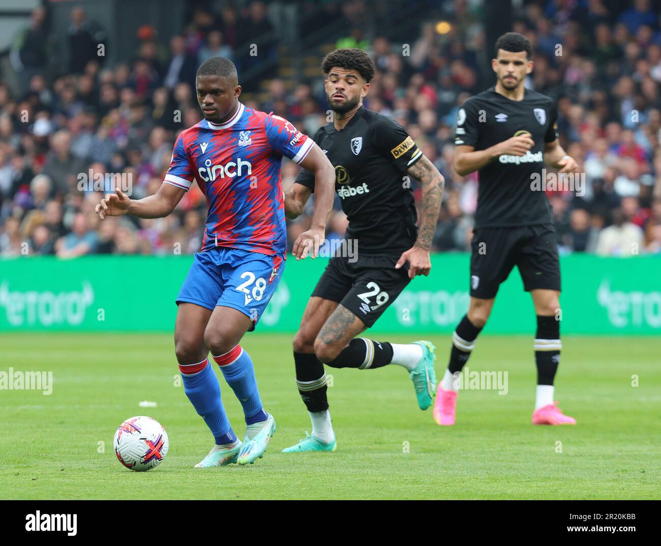 Crystal Palace's Cheick Doucoure holds of Philip Billing of AFC