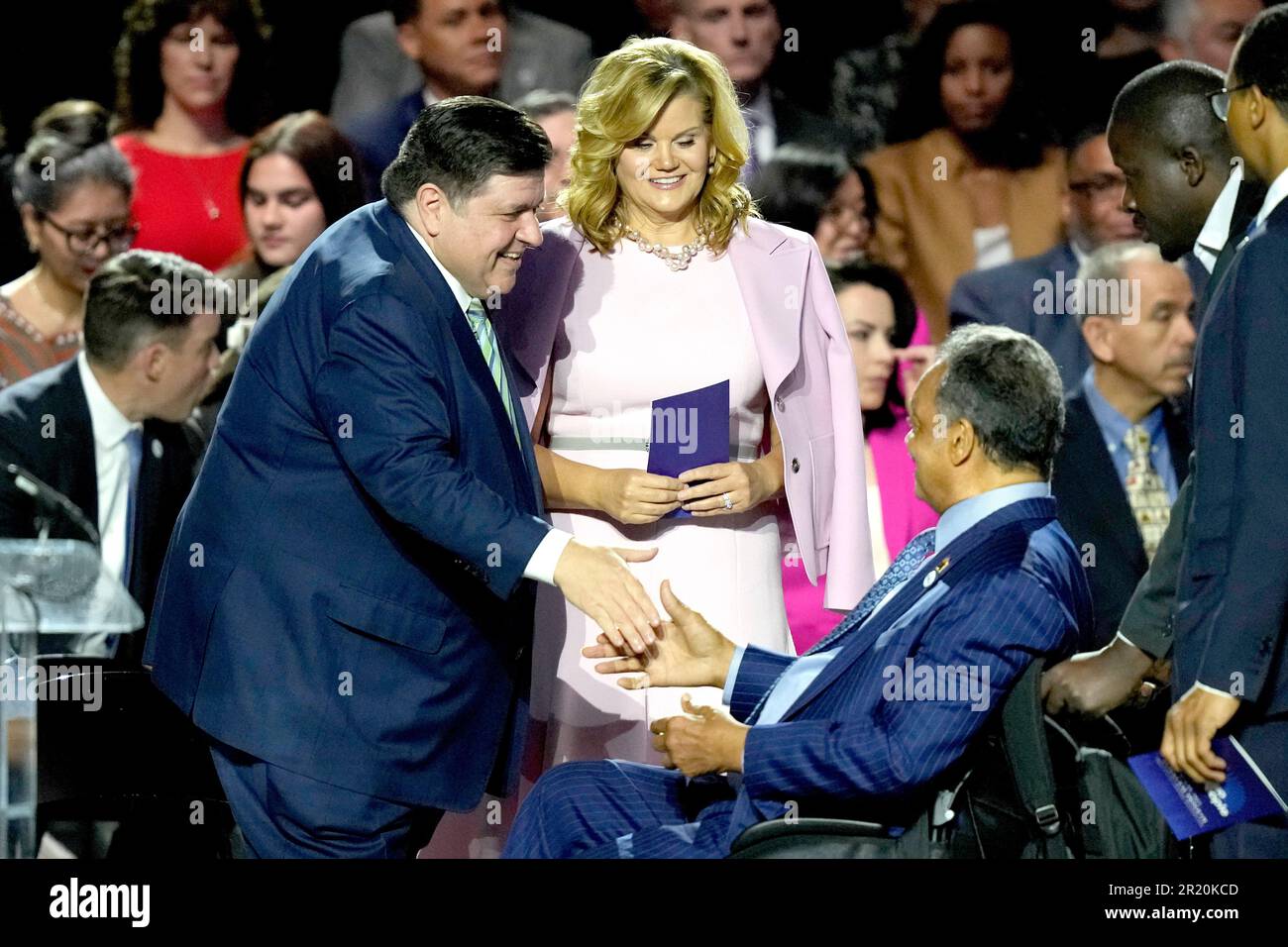 Illinois Gov. J.B. Pritzker, left, greets the Rev. Jesse Jackson Sr