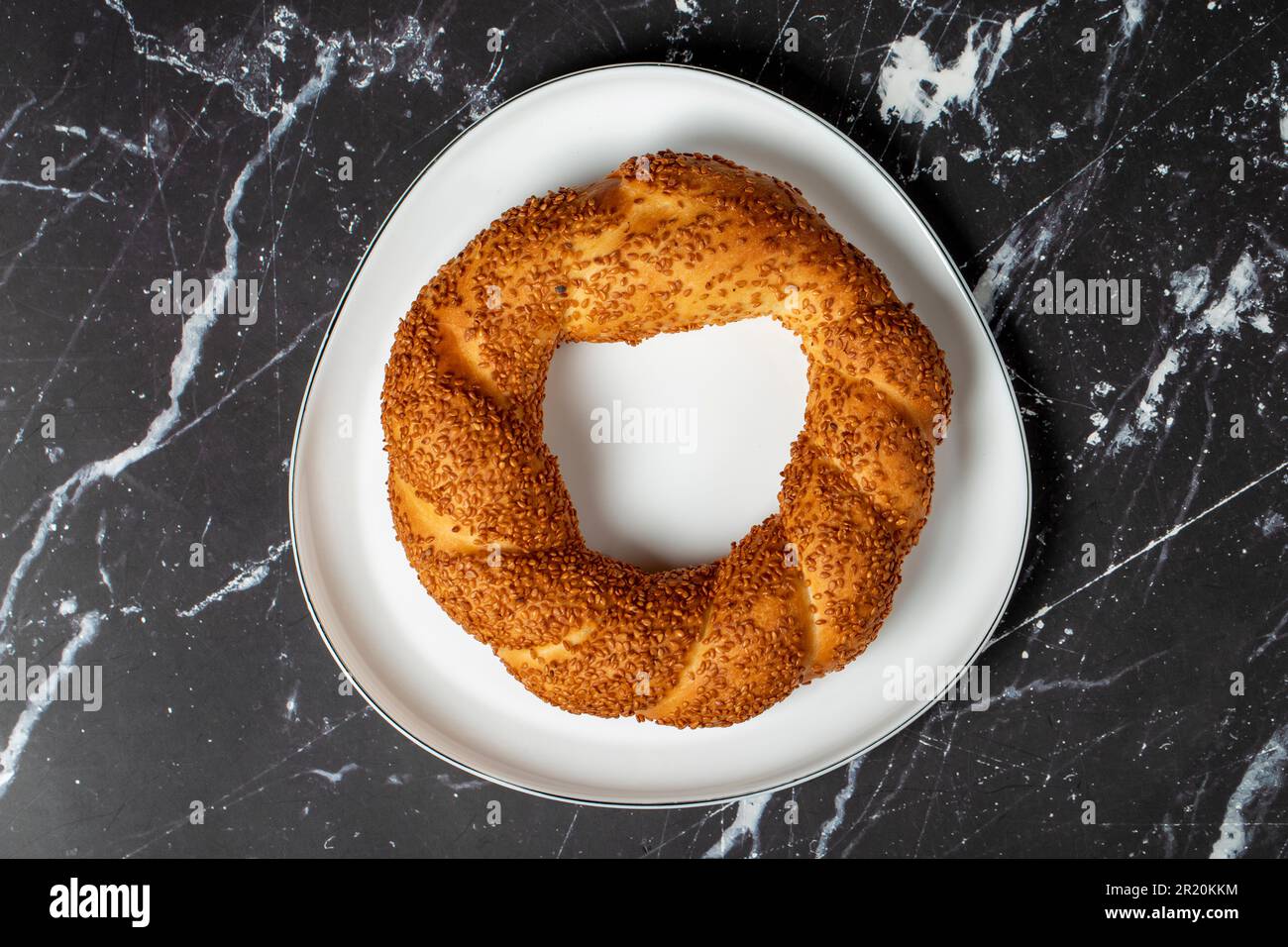 Sesame bagel on dark background. Turkish street food circular bread ...