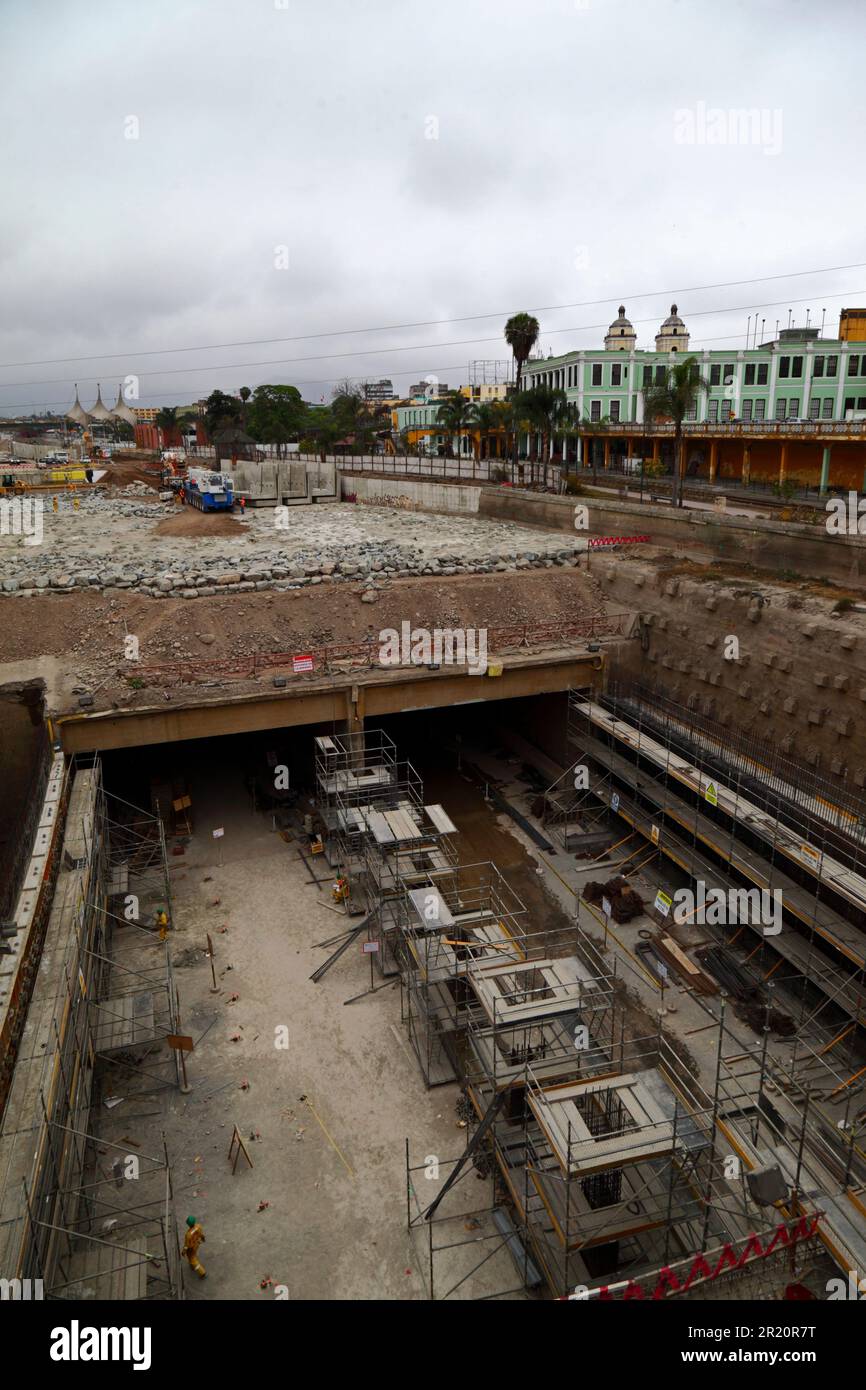 Construction site of tunnel under the River Rimac for a new motorway and Yellow Line Via Expresa bus route, Lima, Peru. The tunnel runs for 1.8km under the River Rimac, which was diverted to allow construction to take place. Works started in January 2012 and took 6 years, the tunnel opened in June 2018. The Brazilian company OAS built the tunnel. The 2 yellow towers in the background are part of San Francisco church in the historic centre. Stock Photo