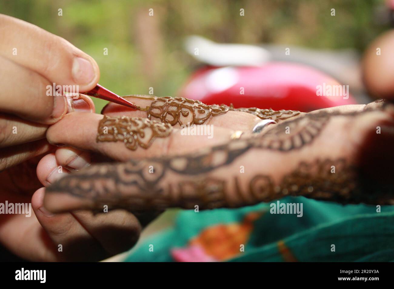 Henna Tattoo Mehndi on hand bridal mehndi Design Background close up Stock Photo
