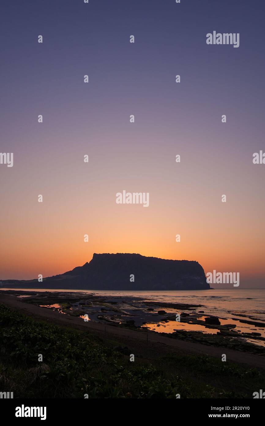 Beautiful sunrise at Seongsan Ilchulbong Peak in Jeju Island, South Korea Stock Photo