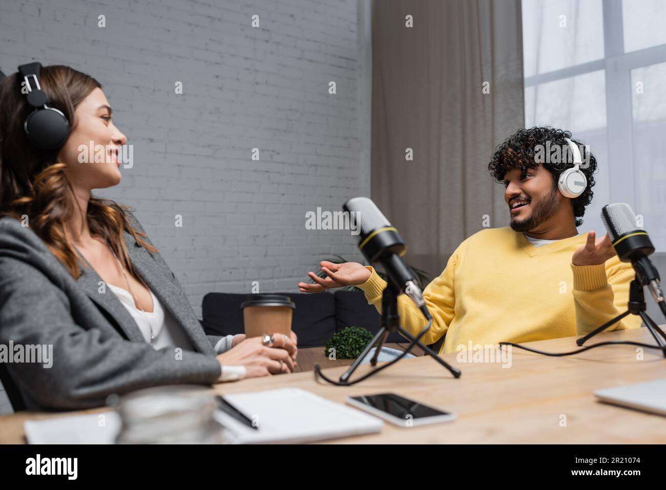 Happy indian man in jumper hi-res stock photography and images - Alamy