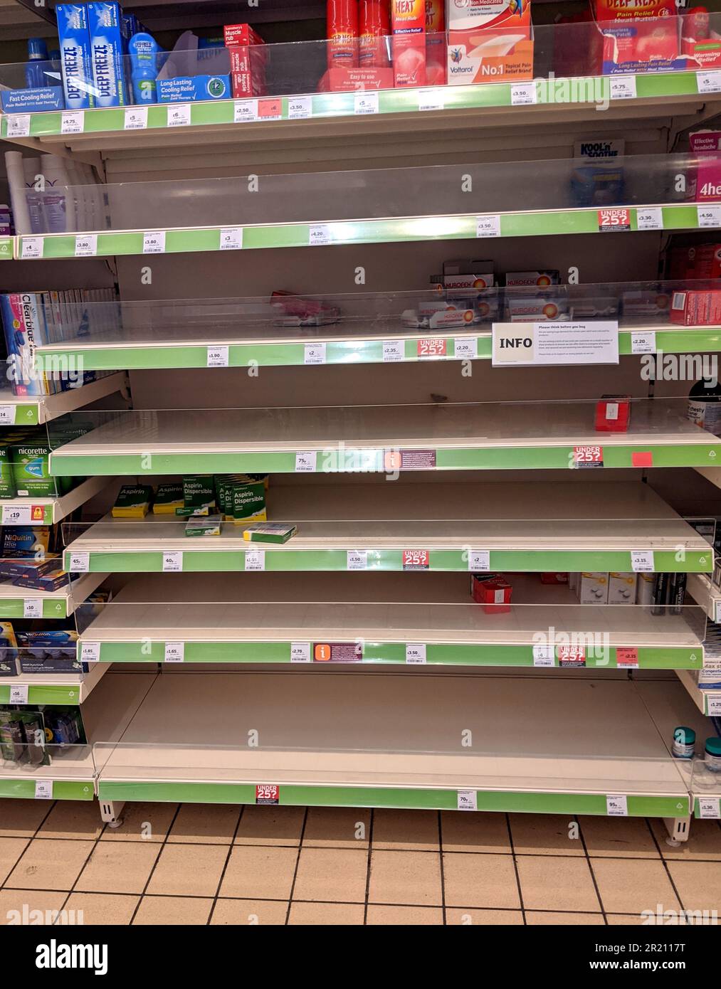 Shelves emptied of paracetamol and ibuprofen at a supermarket.    Panic buying has emptied essential supplies of various products from the shelves of supermarkets as the spread of the COVID-19 coronavirus continues and members of the public buy up stock of toilet paper, soap and basic food stuffs [Thursday 12/03/2020 - Sainsbury, Hornchurch, Essex].    2019-nCoV or COVID-19, informally known as the Wuhan coronavirus, is a contagious virus that causes respiratory infection. It is the cause of the 2019–20 Wuhan coronavirus outbreak. Stock Photo