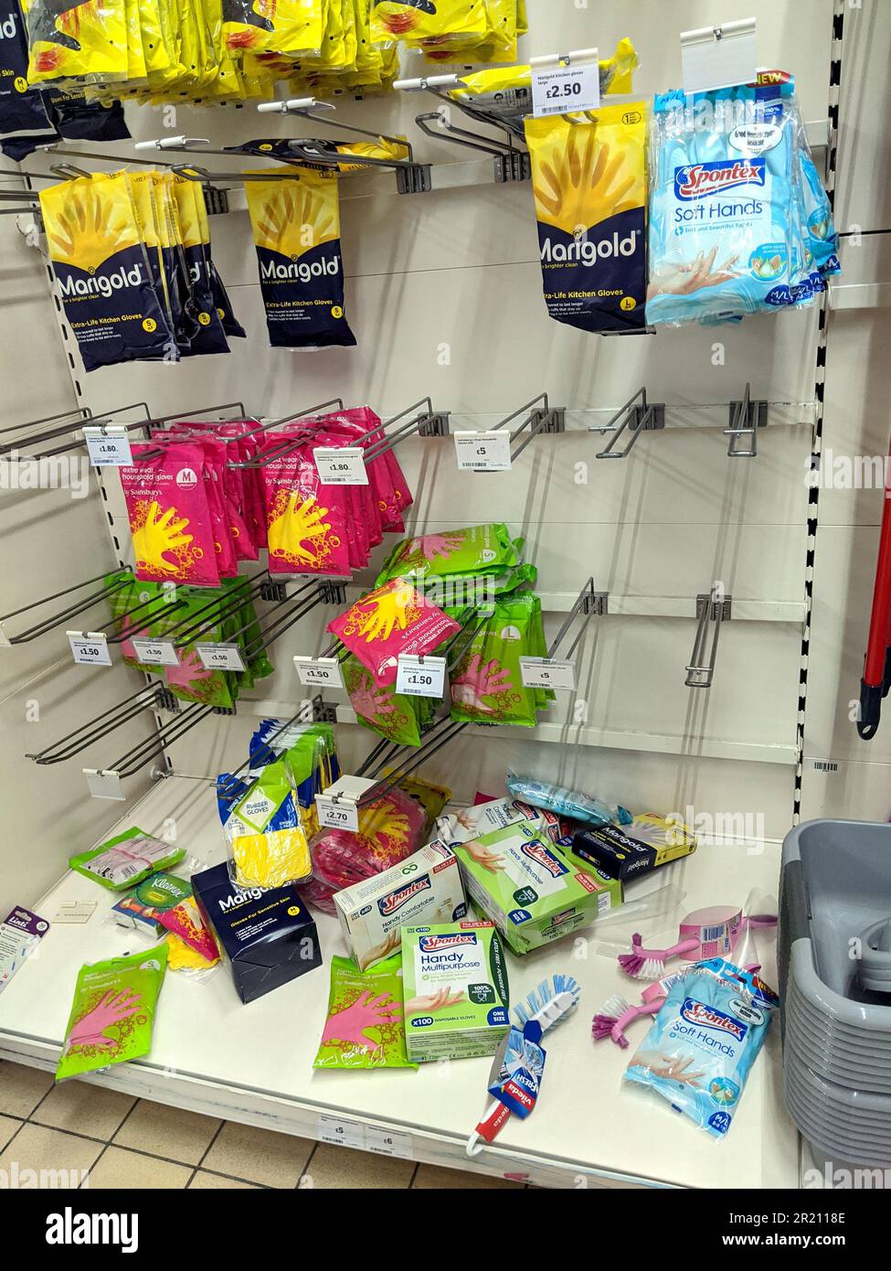 Shelves emptied of disposable gloves at a supermarket.    Panic buying has emptied essential supplies of various products from the shelves of supermarkets as the spread of the COVID-19 coronavirus continues and members of the public buy up stock of toilet paper, soap and basic food stuffs [Thursday 12/03/2020 - Sainsbury, Hornchurch, Essex].    2019-nCoV or COVID-19, informally known as the Wuhan coronavirus, is a contagious virus that causes respiratory infection. It is the cause of the 2019–20 Wuhan coronavirus outbreak. Stock Photo