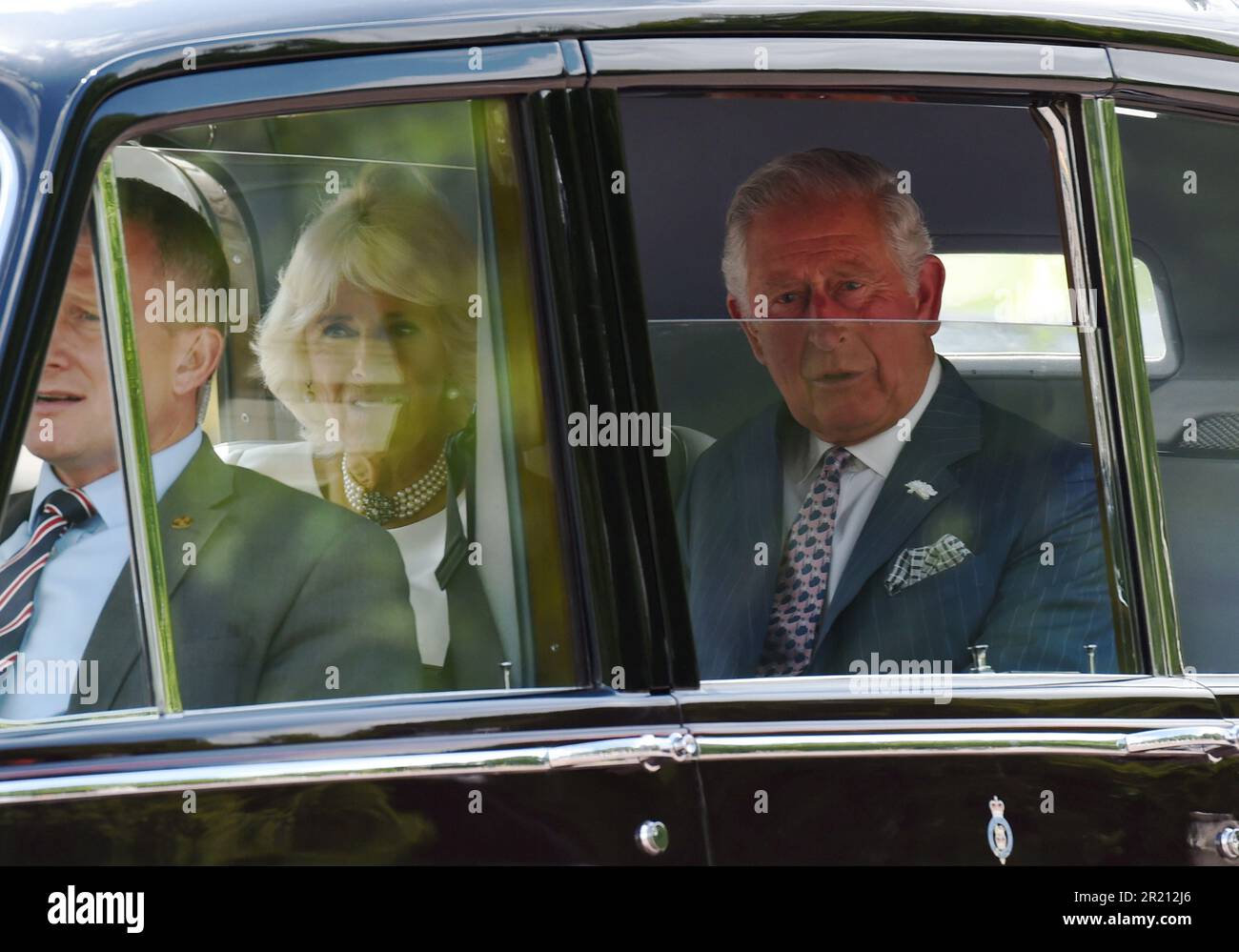 Photograph of Prince Charles and Camilla leaving Buckingham Palace en-route to Westminster Abbey as President Donald Trump arrives in London on an official state visit. Stock Photo