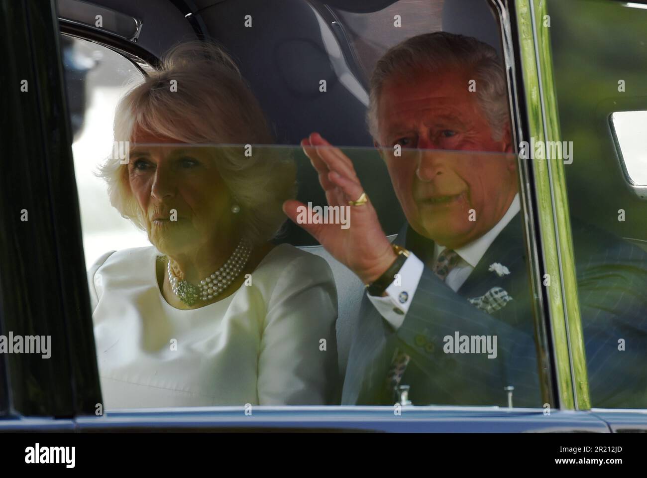 Photograph of Prince Charles and Camilla leaving Buckingham Palace en-route to Westminster Abbey as President Donald Trump arrives in London on an official state visit. Stock Photo