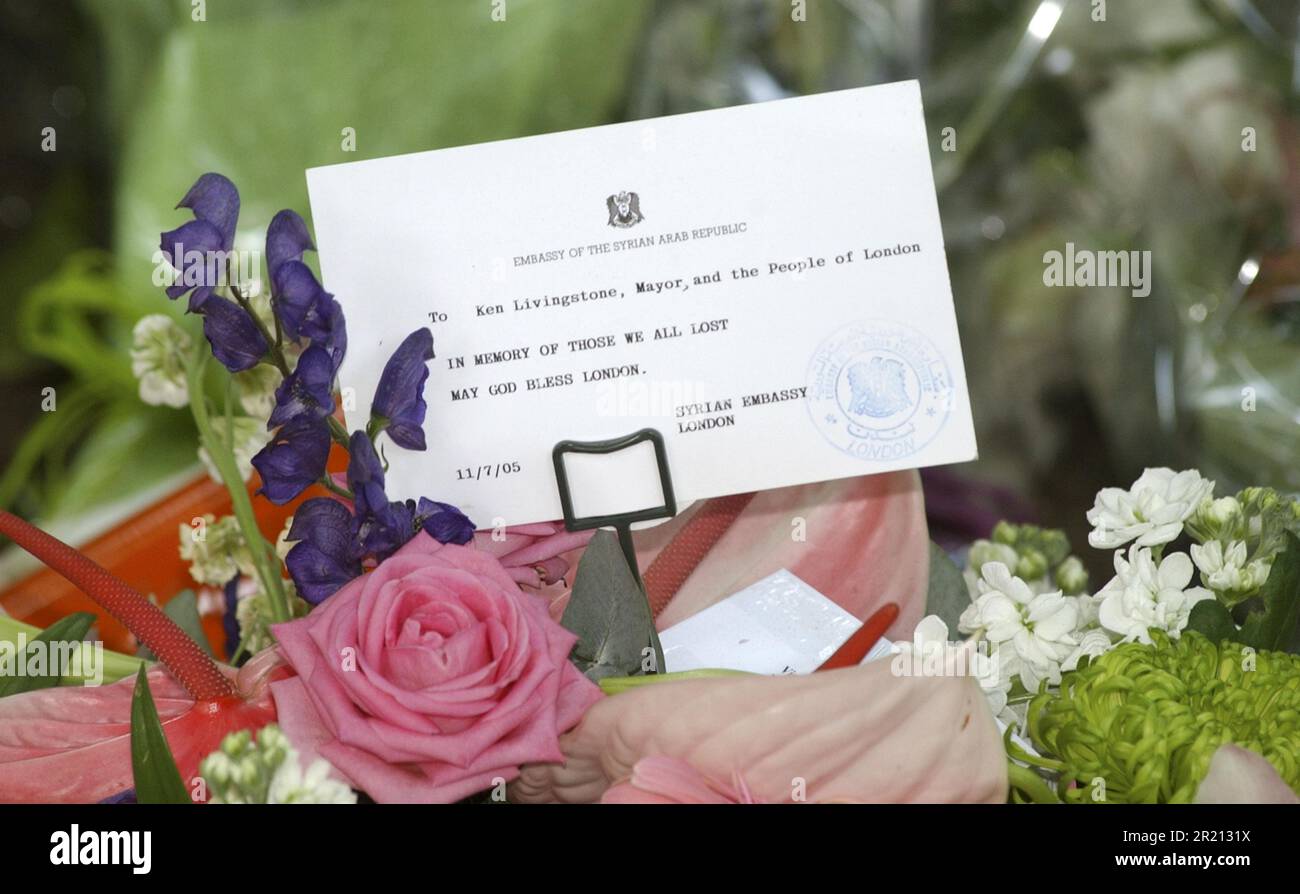 Photograph of a card on one of the many floral tributes left in Victoria Embankment's Memorial Garden where wreaths, flowers and tributes were laid in memory of the victims of London's terror attacks. The card reads 'To Ken Livingstone, Mayor, and the People of London, In Memory of those we all lost, May God Bless London, Syrian Embassy, Syrian Arab Republic.' Stock Photo