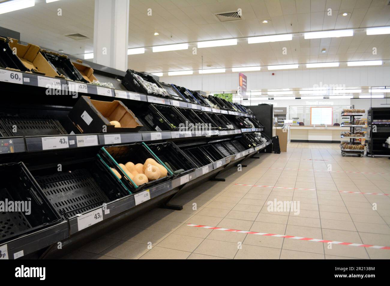 Photograph of empty shelves at a Sainsburys' supermarket, a result of