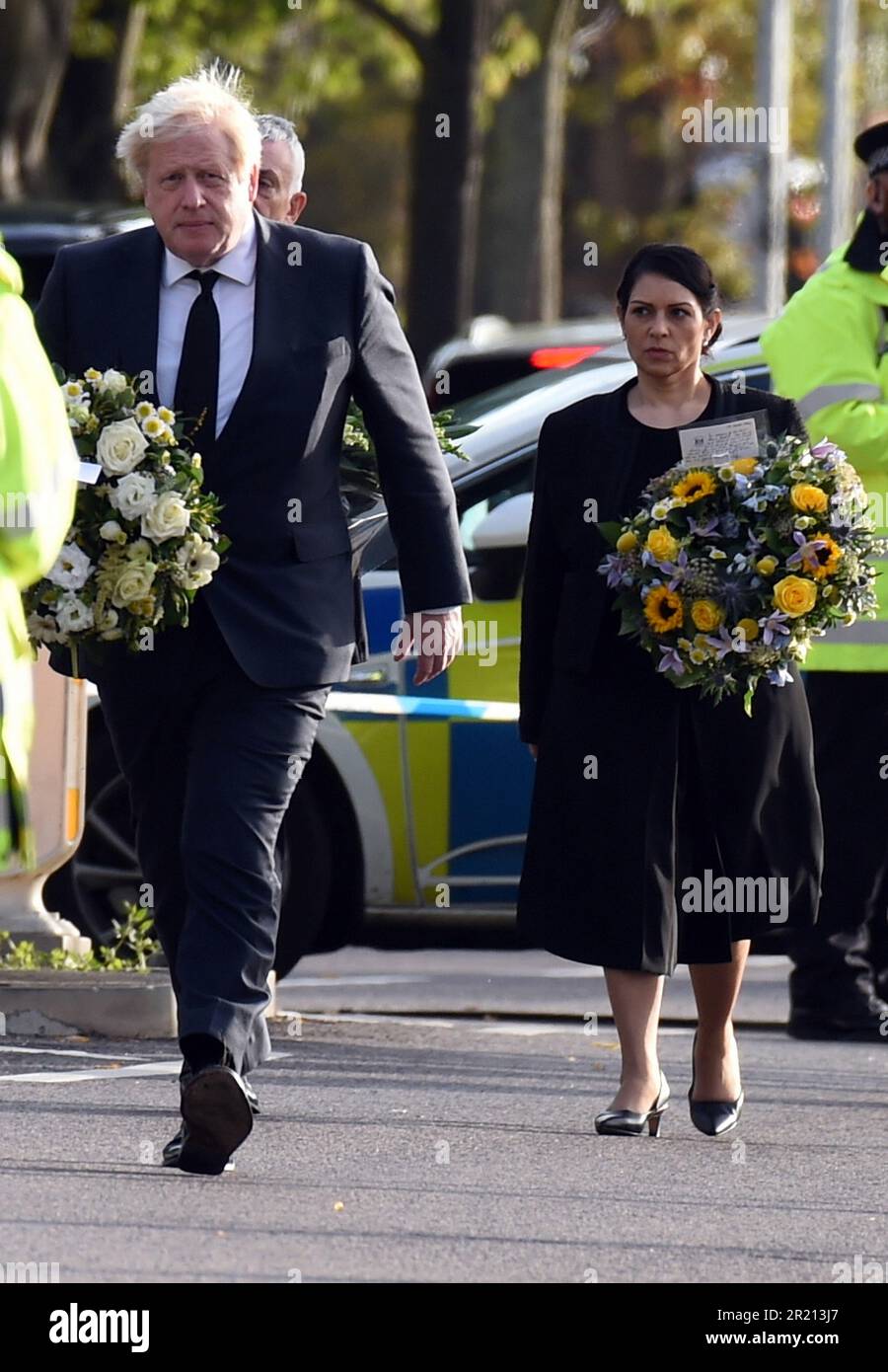Prime Minister Boris Johnson, and Home Secretary Priti Patel, lay floral tributes near Belfairs Methodist Church in Eastwood Road North, Leigh on Sea, Southend on Sea, Essex after Conservative MP Sir David Amess died having being stabbed multiple times at his constituency surgery. October, 2021. Stock Photo
