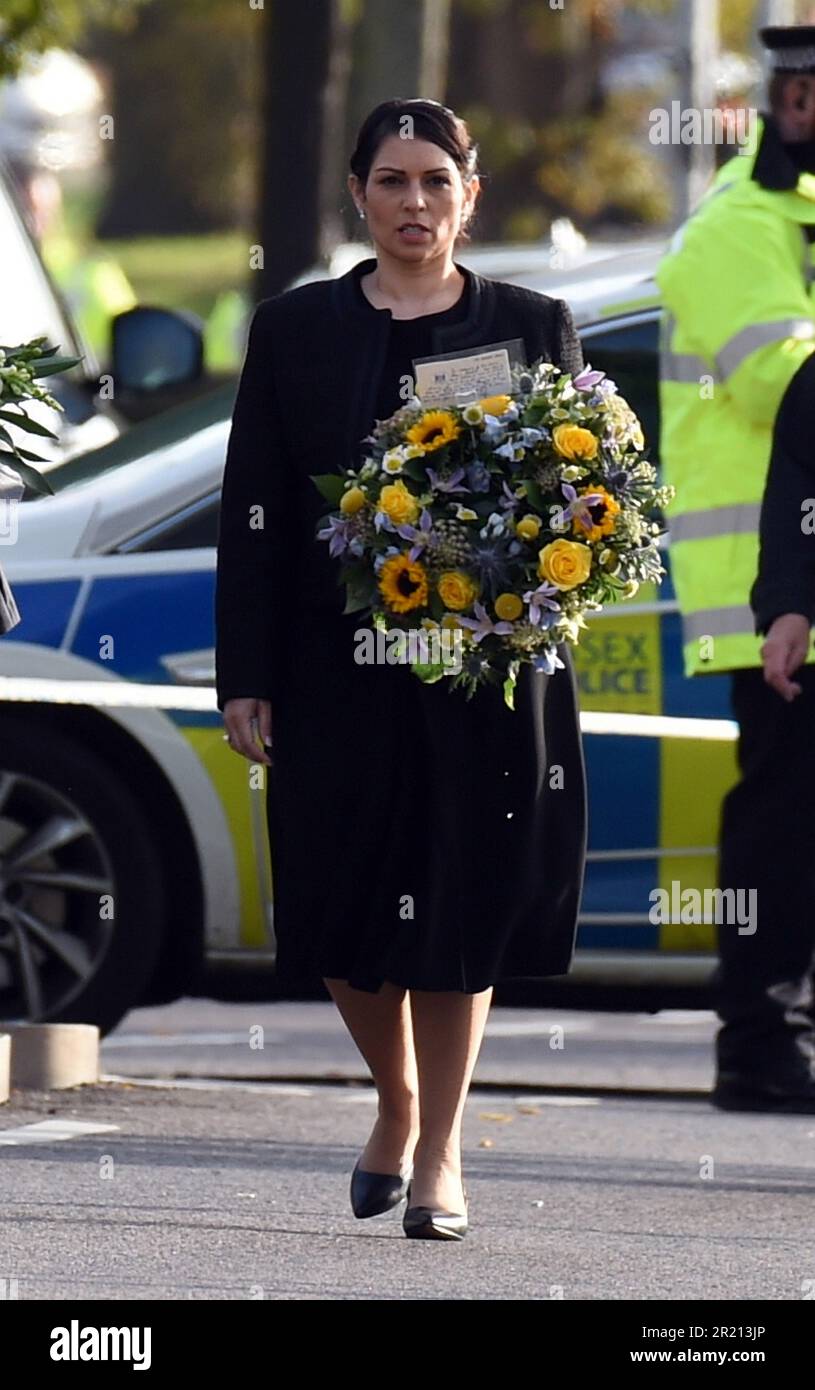 Home Secretary Priti Patel lays a floral tributes near Belfairs Methodist Church in Eastwood Road North, Leigh on Sea, Southend on Sea, Essex after Conservative MP Sir David Amess died having being stabbed multiple times at his constituency surgery. October, 2021. Stock Photo