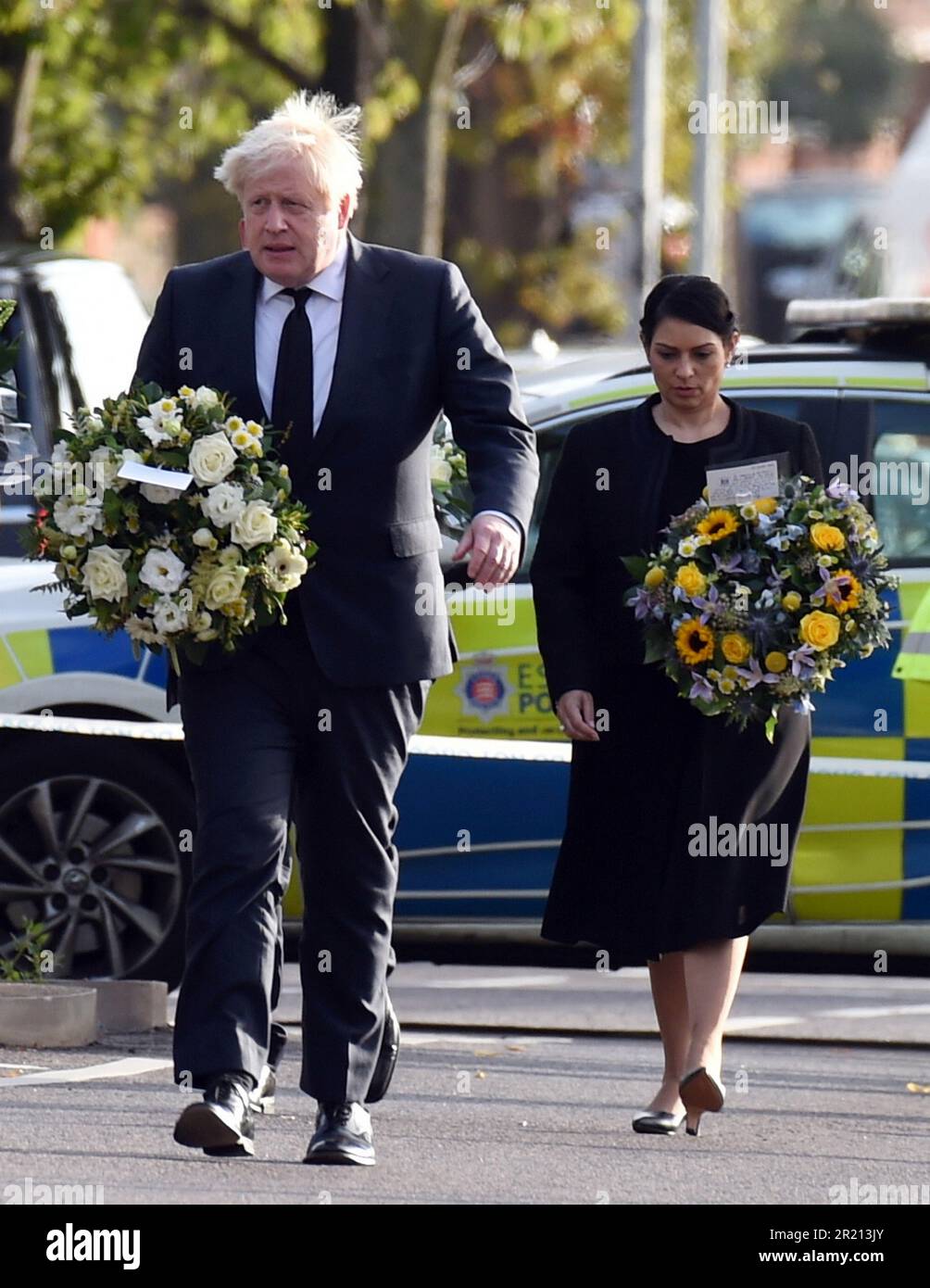 Prime Minister Boris Johnson, and Home Secretary Priti Patel, lay floral tributes near Belfairs Methodist Church in Eastwood Road North, Leigh on Sea, Southend on Sea, Essex after Conservative MP Sir David Amess died having being stabbed multiple times at his constituency surgery. October, 2021. Stock Photo