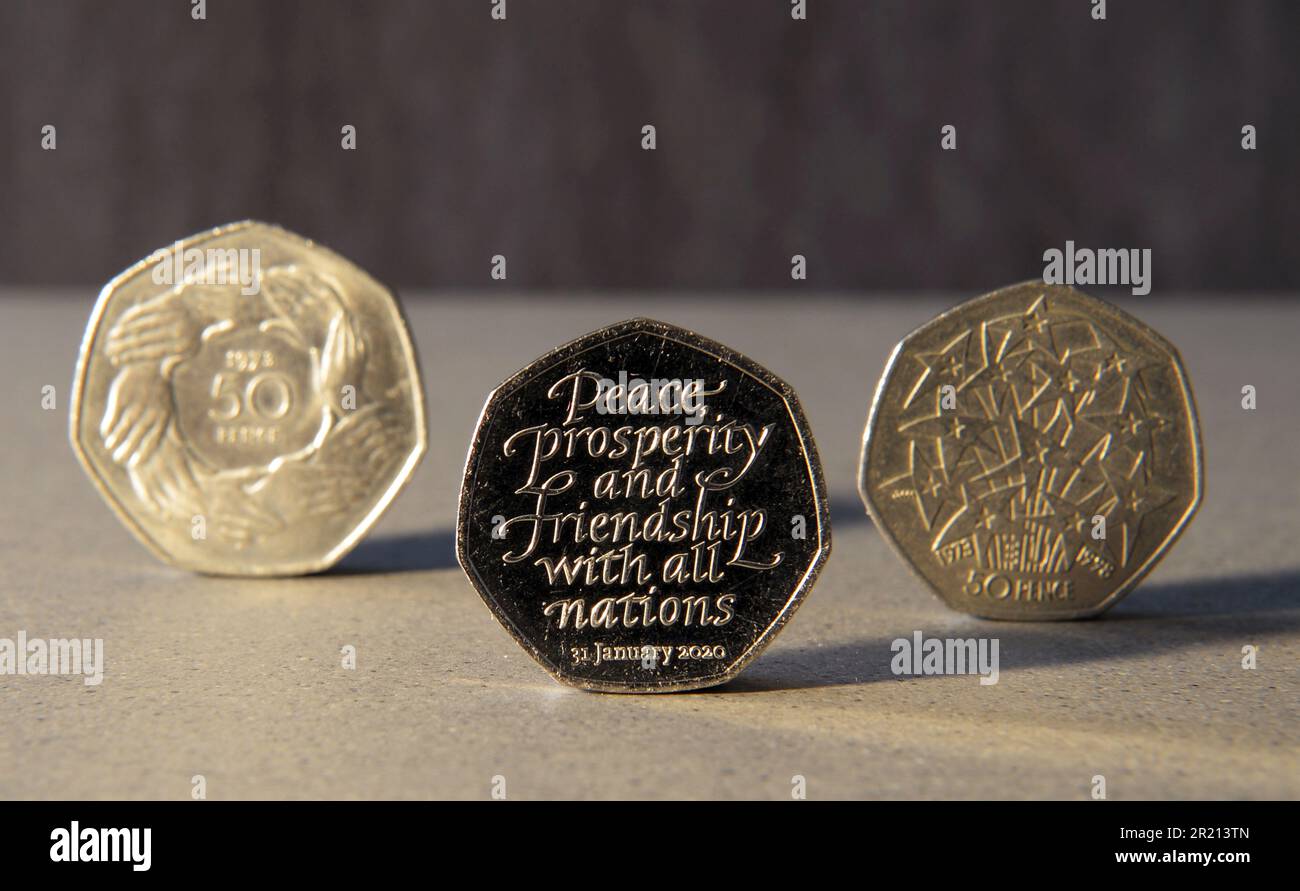 A Brexit 50p coin, a commemorative 50p coin that was struck to mark the planned exit of the United Kingdom from the European Union. It sits alongside two other commemorative coins; one marking the United Kingdom's entry into the European Economic Community in 1973 and another celebrating the UK's accession to the European Economic Community. Stock Photo