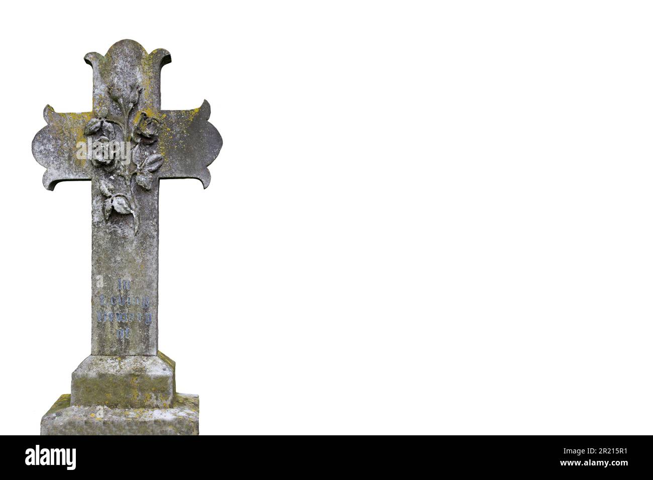 Gravestone cross with a rose carving, with in loving memory of inscription. Isolated on a white background Stock Photo