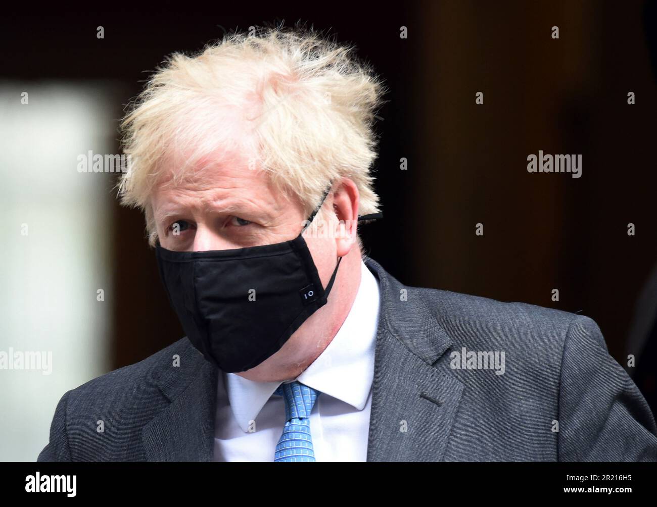 Boris Johnson leaves No.10 Downing Street for PMQs amid the COVID-19 coronavirus pandemic and in a week that he faced a string of serious allegations from financial issues concerning flat refurbishment to reports that he resisted a second lockdown in October 2020 saying, 'No more f***ing lockdowns - let the bodies pile high in their thousands!' Stock Photo