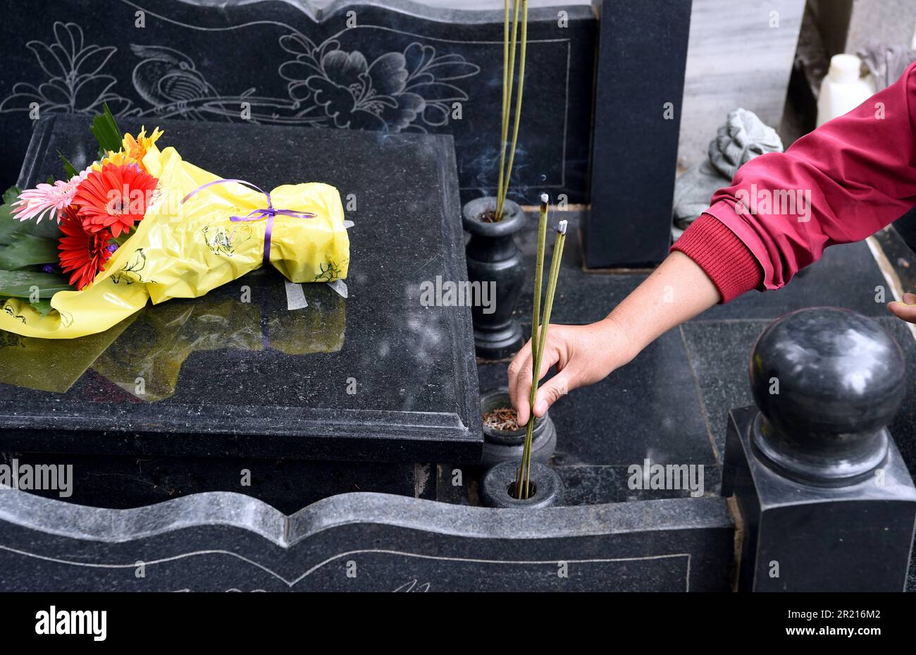 Chinese people partake in the Qingming, or TombSweeping festival, in