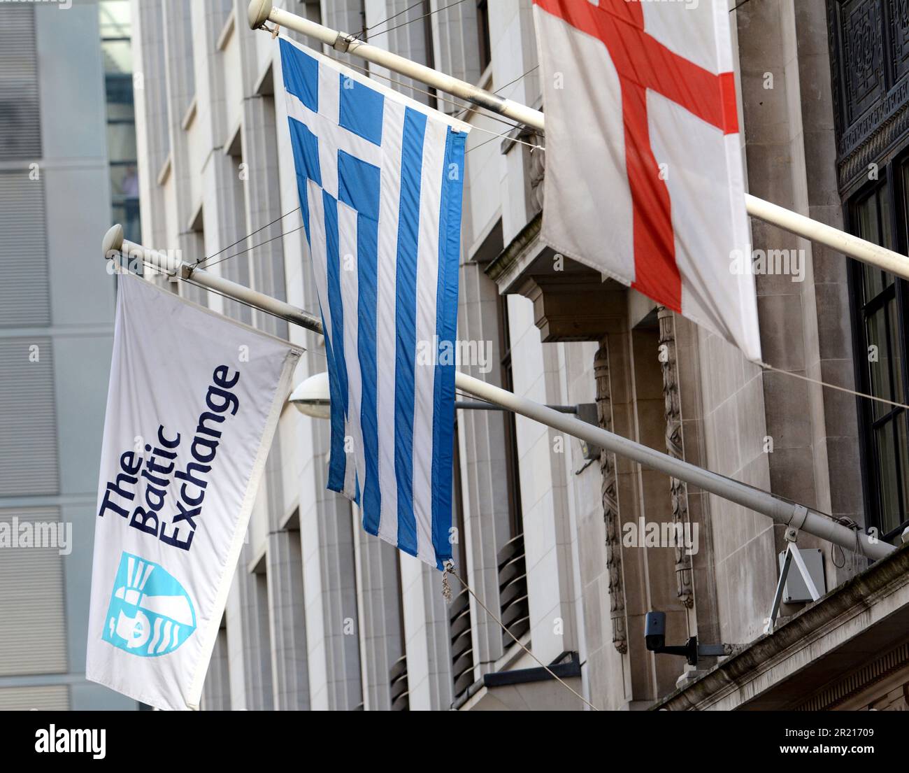 Flags hanging outside the Baltic Exchange in London. A provider of information on maritime transportation markets, used for the trading and settlement of physical and derivative contracts, it is located at 38 St Mary Axe. It has further offices in Europe and across Asia. Stock Photo