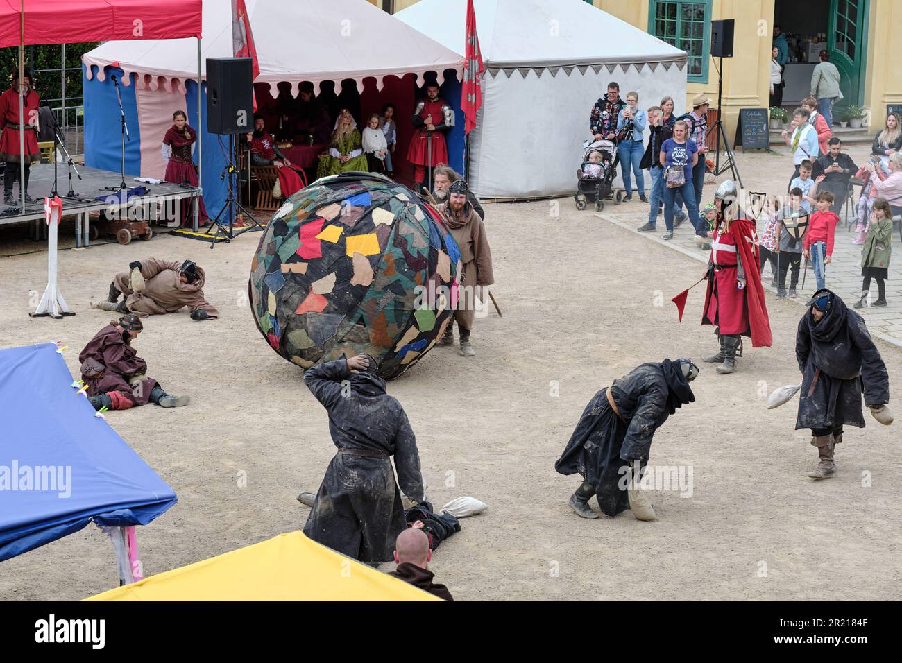 Decin (Tetschen), Czechia - May 14 2023: Medieval humorous show on town market cultural festival on the old castle with fighting monks playing soccer Stock Photo