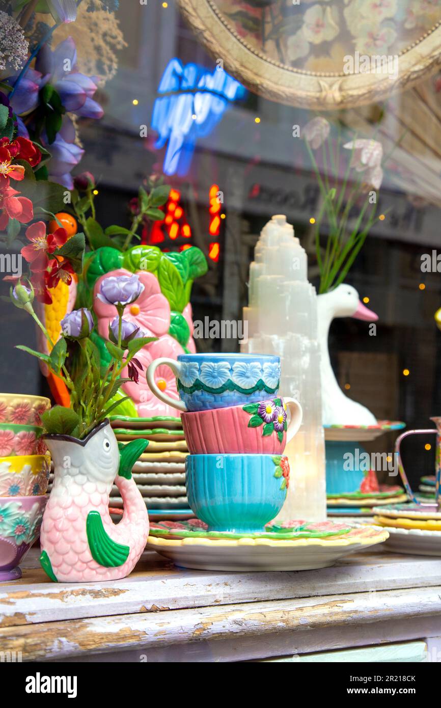 Colourful crockery in the window of antique shop The Clockwork Crow, George Street, Hastings, England, UK Stock Photo