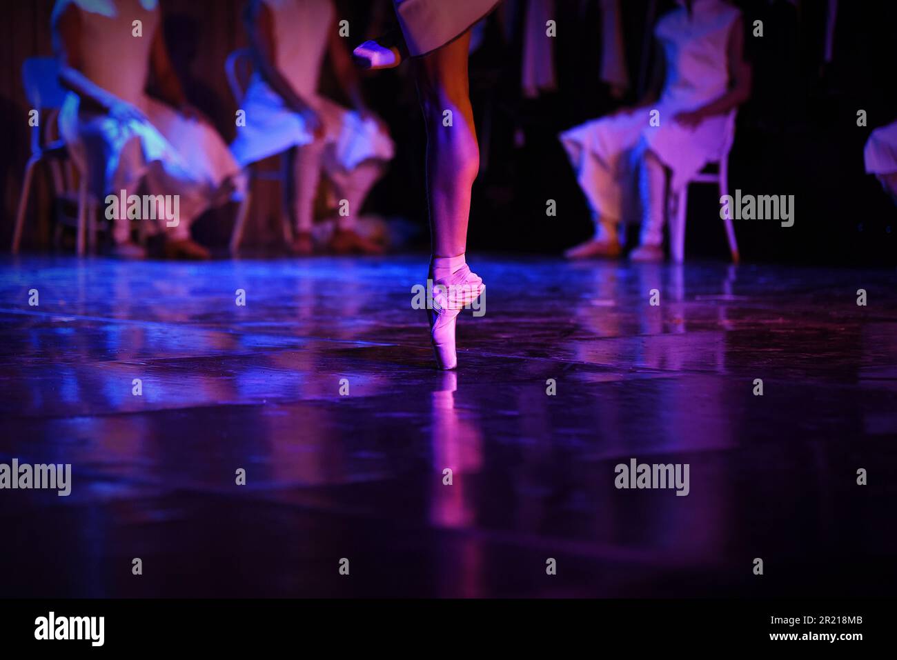 A female ballerina practicing on the stage. Stock Photo