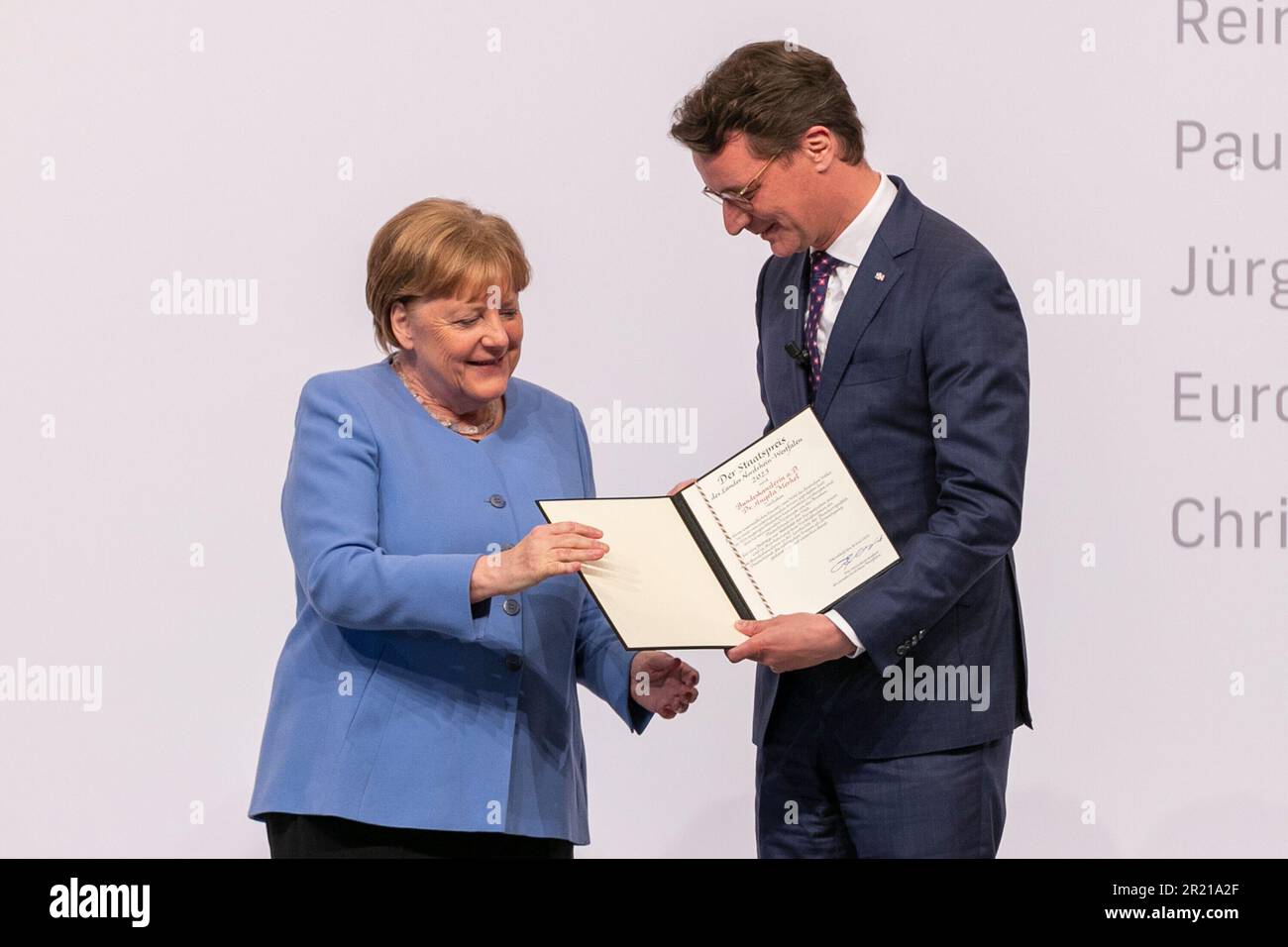 Cologne, Deutschland. 16th May, 2023. dr Angela Merkel (former Chancellor), Hendrik Wuest (Prime Minister North Rhine-Westphalia), Cologne, presentation of the State Prize of the State of North Rhine-Westphalia to former Chancellor Dr. Angela Merkel, May 16, 2023, Flora Cologne. Credit: dpa/Alamy Live News Stock Photo