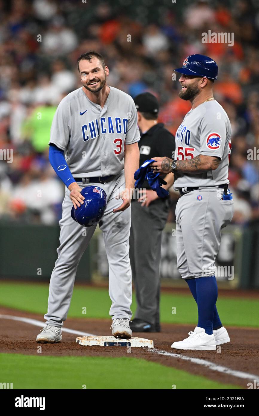 Chicago Cubs first baseman Trey Mancini (36) shares a smile with Chicago Cubs first base coach