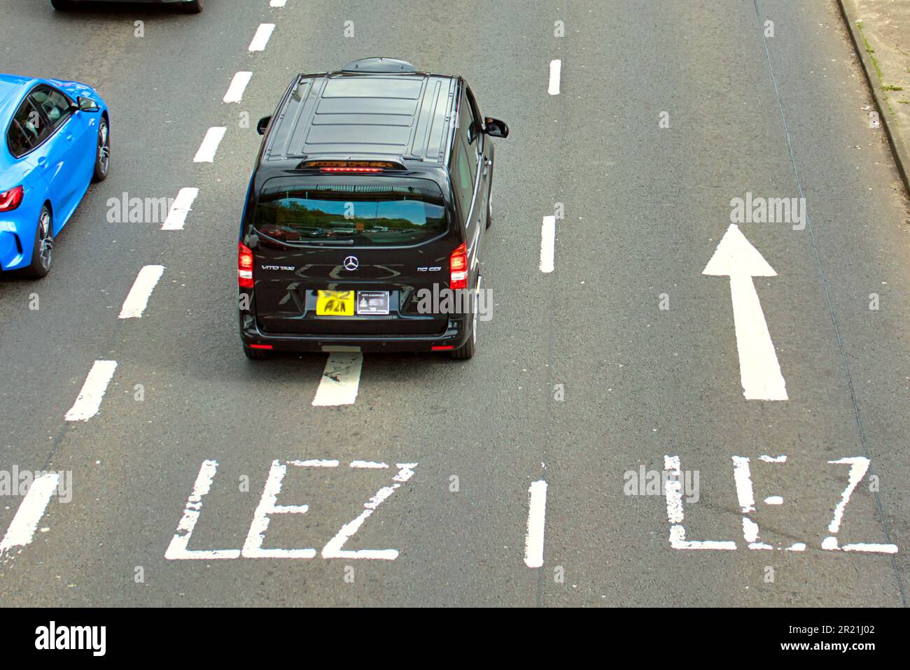 Glasgow, Scotland, UK 16th May, 2023. LEZ Low emission zones preparation sees road signs and painted road directions complete with roadside advert to prepare for the fine start date of the 1st of June in cities all over Scotland. Credit Gerard Ferry/Alamy Live News Stock Photo